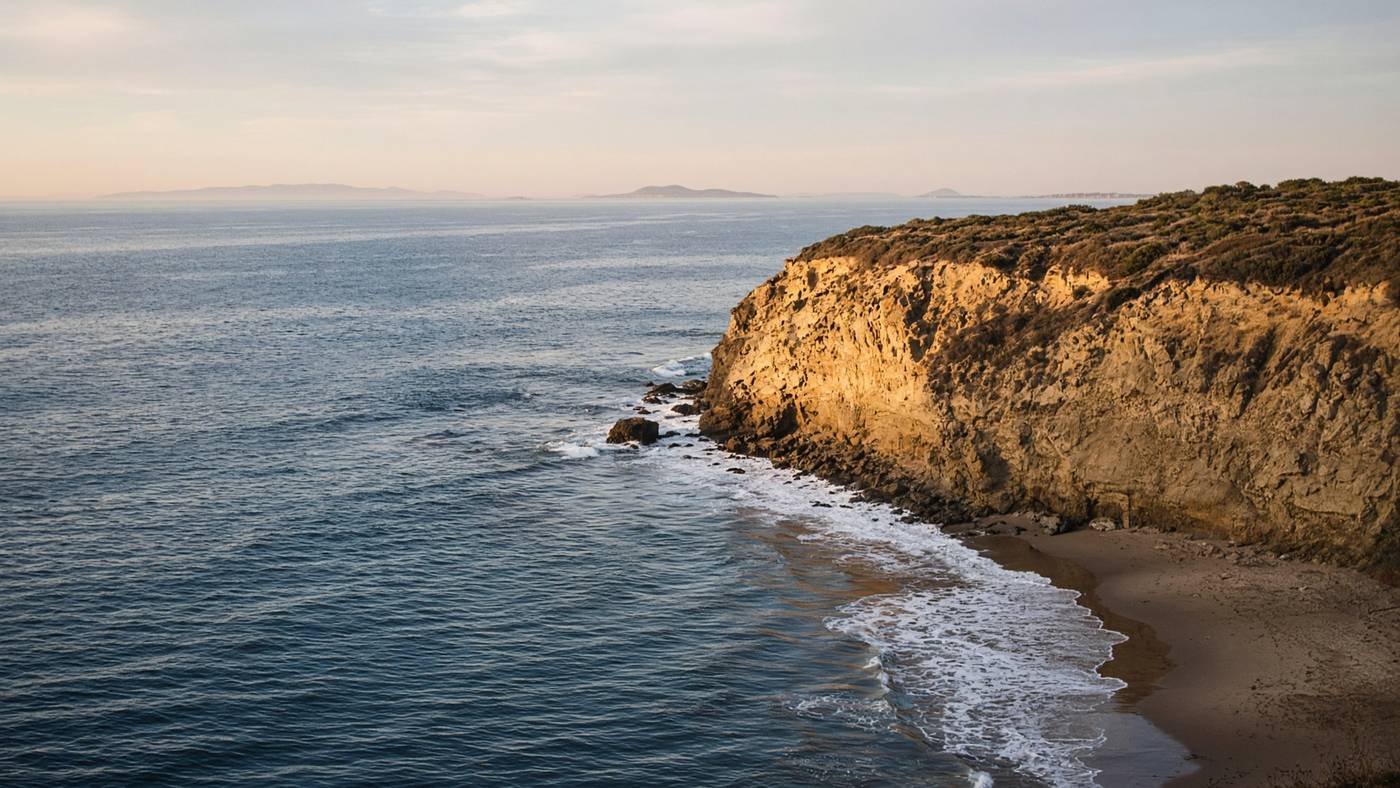 Sandstone bluff at Point Dume dropping to a pocket beach